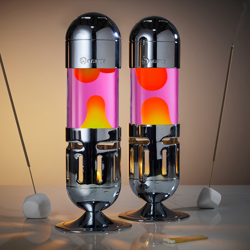 Dvi chromuotos Mathmos Pod žvakinės lavos lempos su rožiniu skysčiu ir geltona lava, žavinga lavos lempa